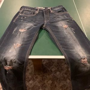 Men’s Buckle Jake Distressed Dark Wash Jeans.